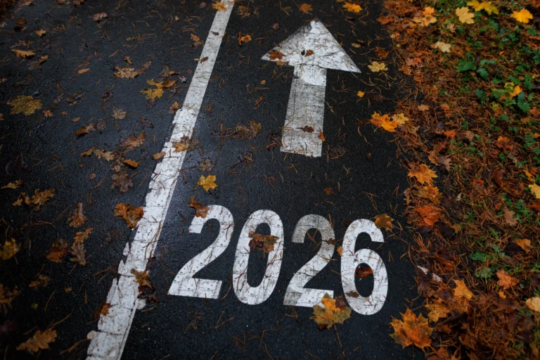 road marking with the number 2026 and an arrow pointing